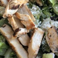 Grilled Chicken Caesar · Crisp romaine lettuce, tender grilled chicken, shaved parmesan, herb croutons, and caesar dr...