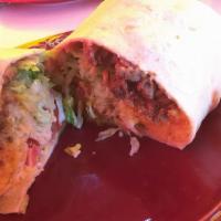 Burrito · Choice of Meat, Refried Beans, Rice, Lettuce, Tomatoes, Cheese and Sour Cream