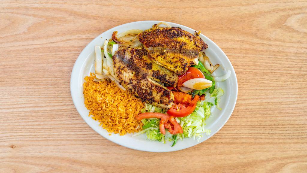 Grilled Fish · Grilled fish with onions, bell peppers, rice & salad.