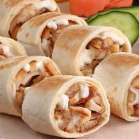 Shawarma Mix · Chicken & beef shawarma topped with onion, tomato, pickles and freshly made garlic sauce wit...