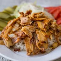 Chicken Shawarma Platter · Over basmati rice served with pickles and garlic sauce.