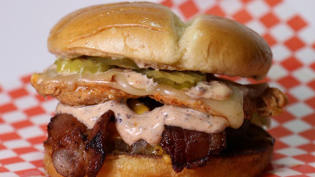 Sobo Special · Grilled Chicken, Burger Patty, Bacon, served to customers preference. We recommend it on a Hawaiian Bun with Pepper Jack cheese, simply with Greenbelt Sauce and grilled onions!