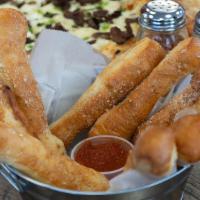 Bread Sticks · 8 breadsticks handmade from our secret recipe pizza dough covered in butter, garlic salt and...