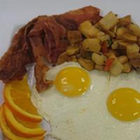 Chicken Fried Steak & Eggs · Country fried steak served with two over easy eggs & potatoes.