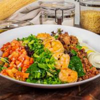 Cajun Cobb Salad · Mixed baby greens tossed with bleu cheese dressing, topped with cajun grilled chicken or shr...