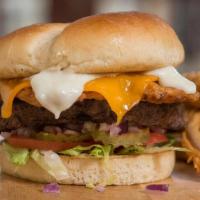 The Chicken Fried Bacon & Egg Burger · 1/2 lb with the works, cheddar, fried egg, and Chicken-Fried-Bacon served with house-made wh...
