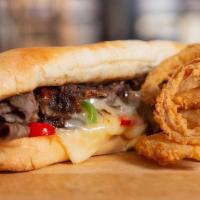 The Philly Cheesesteak Sandwich · Chopped Ribeye Steak, Grilled Red & Green Bell Peppers, Grilled Onions, White Cheddar Cheese...