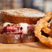 The Reuben Sandwich · Oven roaste premium corned beef, swiss, sauerkraut, creole mustard & side of 1000 island on ...