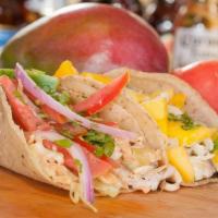 Mango Fish Tacos · Two marinated & Grilled tilapia filets on corn tortillas, shredded cabbage, house-made cream...