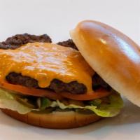 Yummy Queso Burger · Beef Patty, Lettuce, Tomato, Sweet & Spicy Sauce with Queso Cheese.