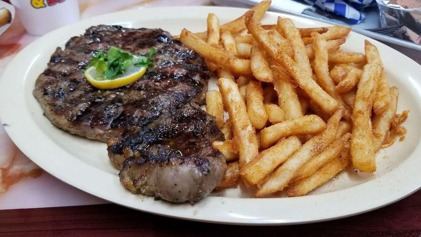 Rib-Eye Steak  With Bone · Rib-eye steak  with Bone served with Yummy rice or french fries or side salad.
