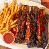 Yummy Beef Ribs · Slow cooked baby beef ribs with French fries and Yummy bbq sauce.