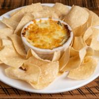 Spinach & Artichoke Dip · Signature dishes. Served with tortilla chips.