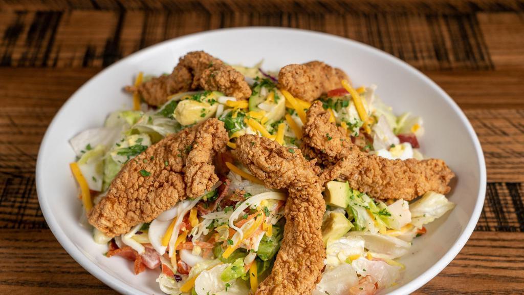 Big Rock Chopped Salad · Chopped romaine and iceberg lettuce, chicken tender strips, Monterey Jack and Cheddar cheese, hearts of palm, cucumbers, tomato, applewood bacon, avocado, carrots, egg and ranch dressing.