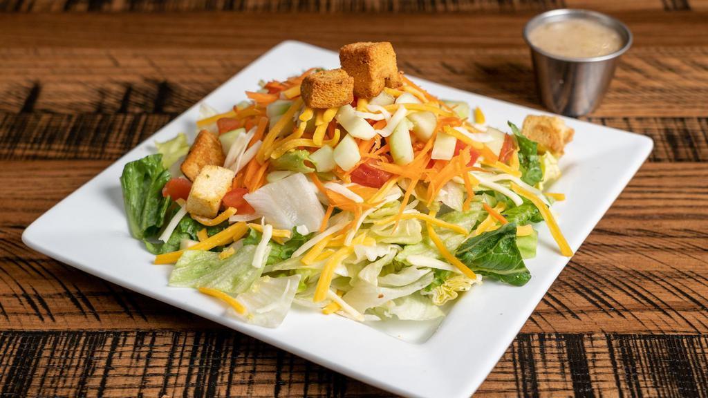 Side House Salad · Romaine and iceberg lettuce, red cabbage, carrots, diced tomatoes, cucumber, Cheddar, Monterey Jack cheese, and house-made croutons.