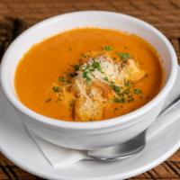 Tomato Basil Soup · Cup, Topped with Parmesan cheese and house-made croutons.