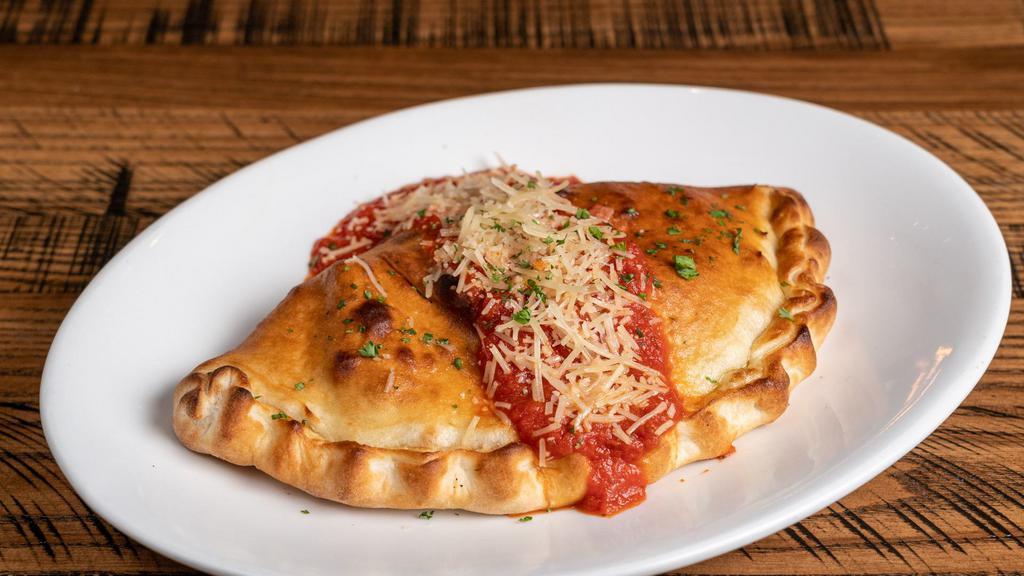 Quarry Calzone · Mozzarella, parmesan, provolone cheese with pepperoni, Italian sausage, mushrooms, pizza sauce. Wrapped up in pizza dough and baked to order.