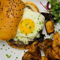 Breakfast Burger · Kobe burger topped with a fried egg , bacon and Vermont cheddar, served with skillet potatoes
