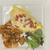 Brisket Omelet · Topped with fresh pico and queso, served with skillet potatoes