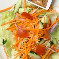 House Salad · Lettuce, carrot, tomato, red onion, cucumber, with peanut dressing.