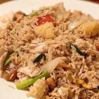Pineapple Fried Rice · Fried rice with tomato, egg, yellow onion, green onion, pineapple, and cashew nut cooked in ...