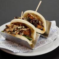 Vegan Buns · Two steamed buns filled with umami shiitake mushrooms, sesame seeds, fried onion, baby mix g...