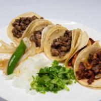 Taco Plate Corn · 3 tacos, your choice of meat (asada,pastor, barbacoa, chicken) rice and beans.