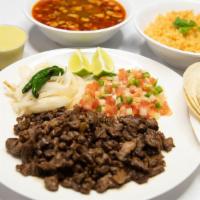 Carne Asada
 · A Carne Asada plate  rice and beans , 5 corn tortillas and 2 salsas.