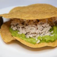 Tostada Siberia
 · Shredded chicked tostada with guacamole and sour cream.