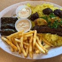 Mix Gyro Plate · Grilled marinated beef and chicken gyro served on a bed of rice and your choice of two sides.