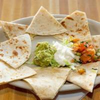 Quesadillas · Flour tortillas stuffed with melted monterrey jack cheese and your choice of beef or chicken...