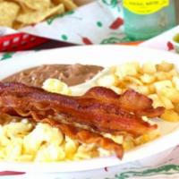 Gringo Plate · A timeless breakfast classic served with scrambled eggs, three strips of bacon, beans, potat...