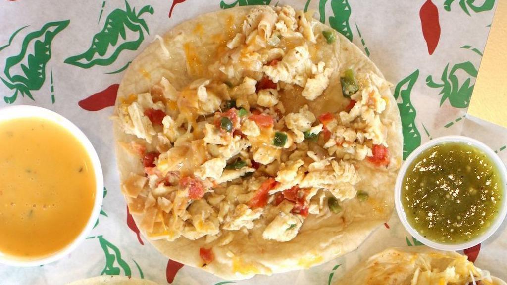 Mia'S Migas Taco · Bits of corn tortilla, jalapeño pepper, tomatoes, and onions mixed in with our scrambled eggs, and shredded cheese.
