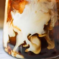 Iced Coffee · Cold coffee served over ice and milk