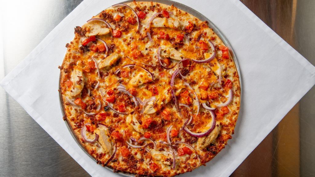 Chicken Bacon Ranch (Medium) · This savory pizza is topped with our grilled chicken, bacon, Cheddar cheese, tomatoes, red onions, and creamy ranch sauce. Our crew's favorite!