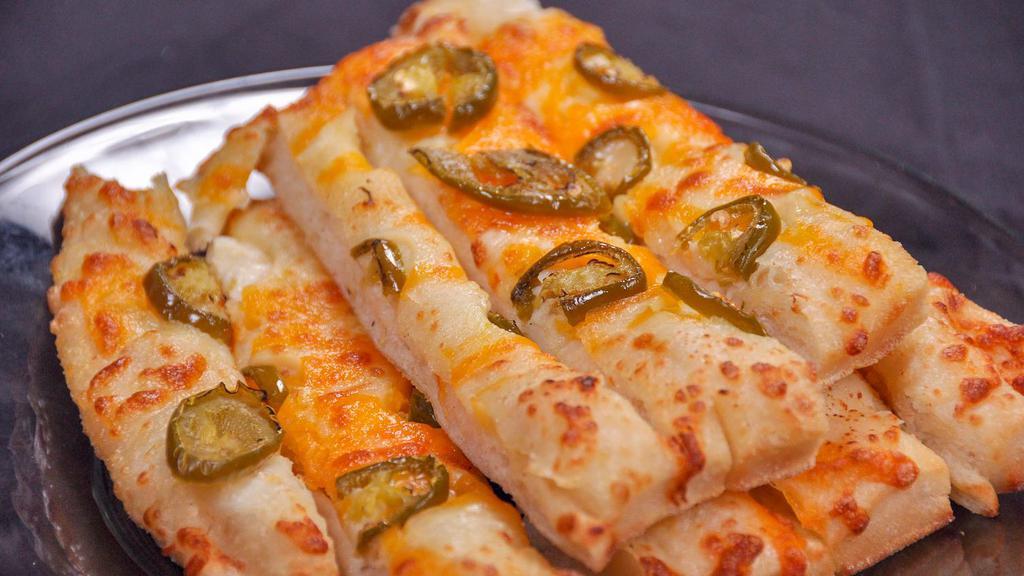 Cheesy Jalapeño Breadsticks · With jalapeño and a mixture of cheddar and mozzarella cheese. You'll love this twist on garlic Jim's cheese breadsticks. Comes with marinara and garlic butter.