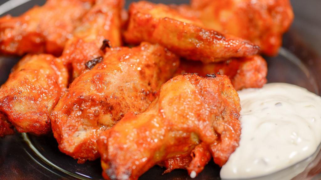 Bone-In Chicken Wings · Bone-In Wings available in Hot or Smokin Sweet BBQ flavor. Served with your choice of dipping sauce.