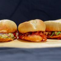 Meatball Parmesan Sandwich · Meatballs, parmesan cheese, classic red sauce, provolone cheese, Italian spices.
