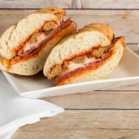 Gourmet Italian Sandwich · Italian sausage, spicy pepperoni, and salami. Topped with fresh mozzarella cheese, bacon, an...
