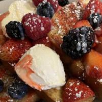 Very Berry French Toast · Three slices of French toast, mixed berries, topped with mascarpone, vanilla glaze, and berr...