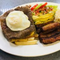 Bistec A Lo Pobre · delicious marinated milanesa steak served with fried plantains, avocado, french fries, rice,...