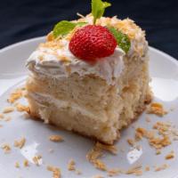 Granny'S Cake · Moist cake with coconut cream, whipped cream icing