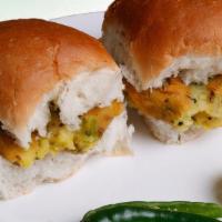 Bombay Vada Pav(2 Pcs) · Deep fried potato patty with cilantro & indian spices served on pav bread with garlic chutney.