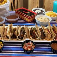 Taco Box - Serves 4 To 6 · 4 grilled steak with jalapeno relish, 4 grilled chicken tacos, 4 BBQ pork tacos with pickled...