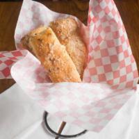 Garlic Bread · Our famous, fresh, homemade buttered garlic bread.