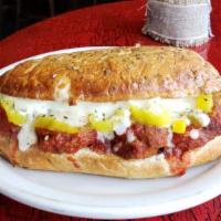 Meatball Hero · House-made meatballs, mozzarella cheese, banana peppers, marinara sauce served on a garlic-b...