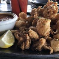 Calamari · Lightly battered and fried, served with homemade tomato sauce or avgolemono sauce.