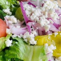 Small Salad · Mixed field greens, tomato, onion, pepperoncini, olives, feta and Greek dressing.