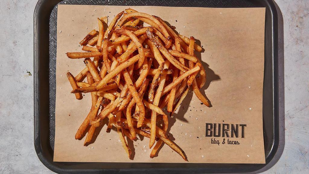 Shoestring Fries · By Burnt BBQ & Tacos. Large portion of hand cut french fries that will rock your core. Served with side of BBQ sauce. Contains gluten. We cannot make substitutions.