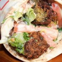 Falafel Shawarma · Falafel. Parsley, lettuce, tomato, green onion with hummus and tahini sauce.